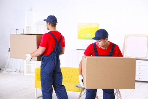Moving van loading boxes and furniture during a local relocation service