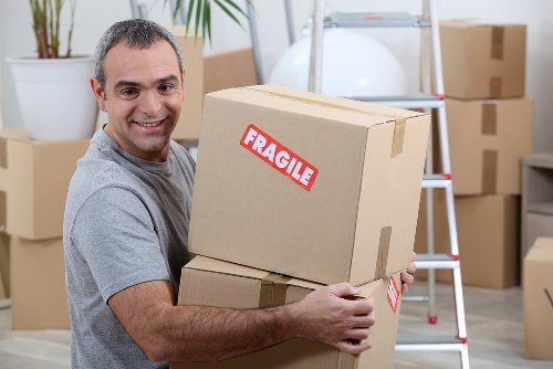 Removal van and packed boxes for a home move in Cockfosters