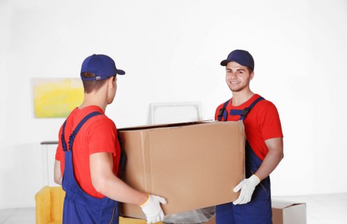 Removal team helping a Cockfosters home move with boxes and furniture