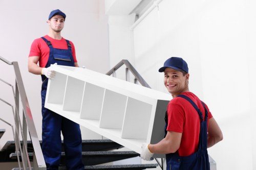 Removal van and moving team preparing a local house move in Cockfosters