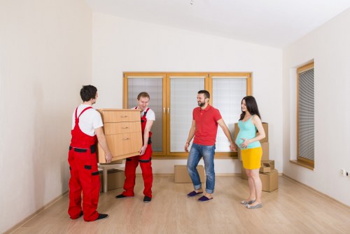 Loading household items into a van for a local move