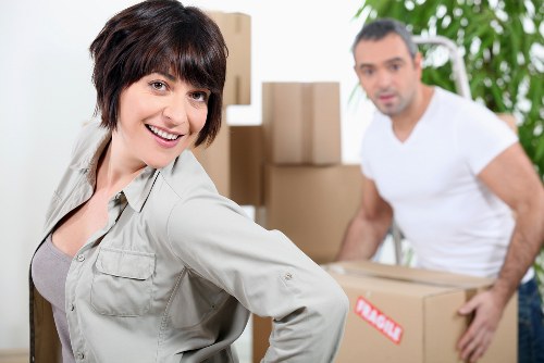 Trained moving staff handling boxes with care in Cockfosters