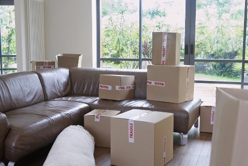 Packed boxes and furniture ready for transport from a Cockfosters property