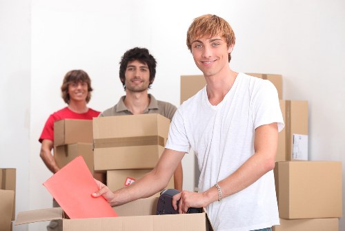 Furniture and boxes arranged inside a removal truck