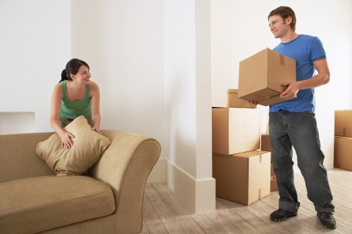 Careful loading of bulky items by movers serving Cockfosters